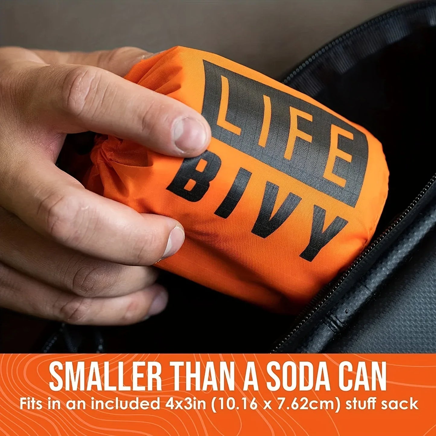 Orange 'LIFE BIVY' bag held by a hand with text indicating it's smaller than a soda can.