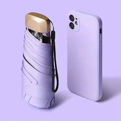 Mini paraguas de bolsillo para lluvia, sombrilla plegable de vinilo con protección ultravioleta UV, parasol de bolsillo, cápsula